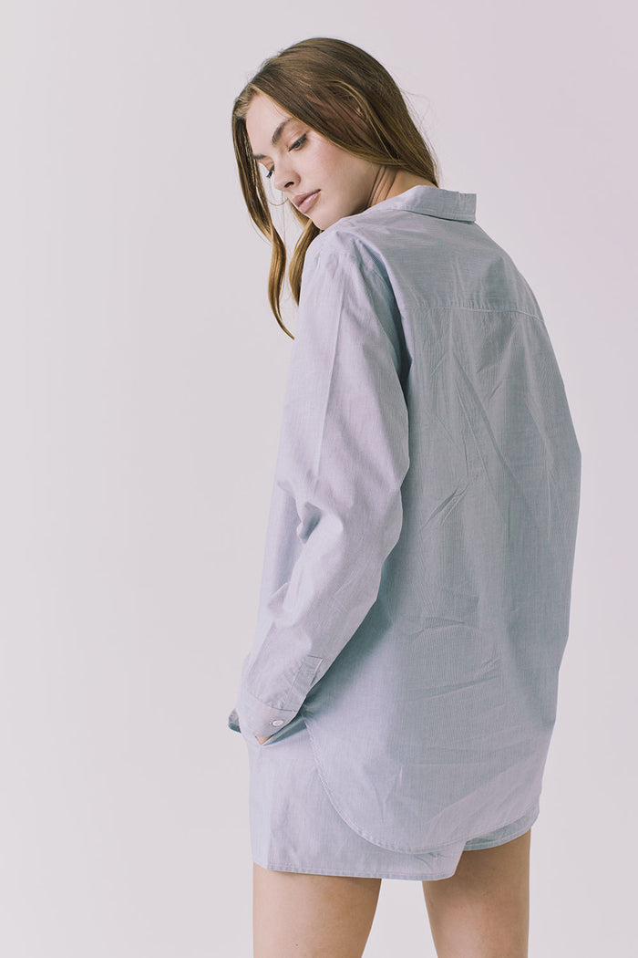 Chaser Paso Pinstripe Button Up in Navy shown over shoulder with fluid lightweight texture