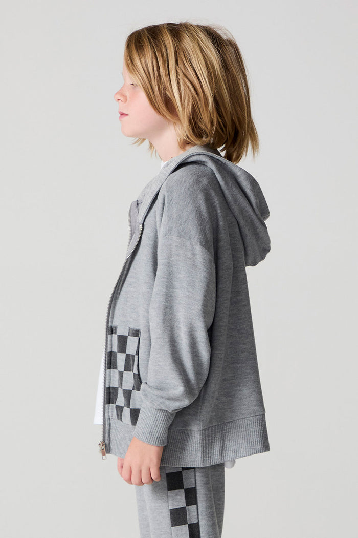 Side view of a boy wearing the Chaser Paxton Heather Grey Zip Up Hoodie on a neutral background