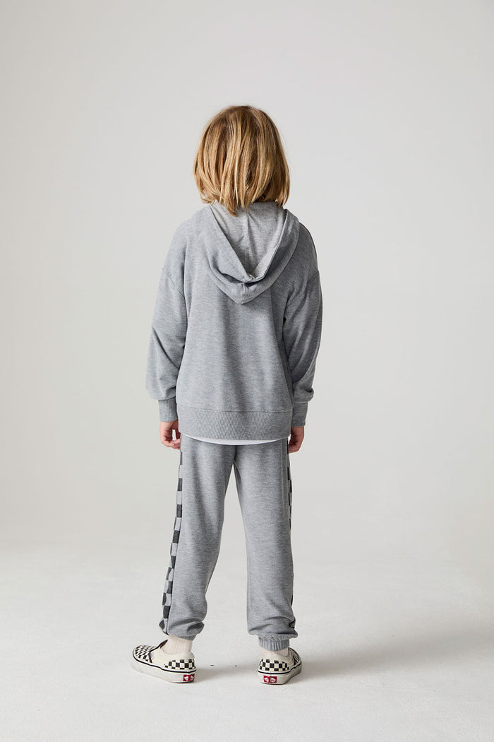 Full body back view of a boy wearing the Chaser Paxton Heather Grey Zip Up Hoodie on a neutral background