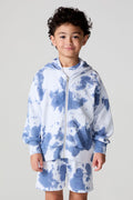 Front view of a boy wearing the Chaser Paxton Mistel Tie Dye Zip Up Hoodie on a neutral background
