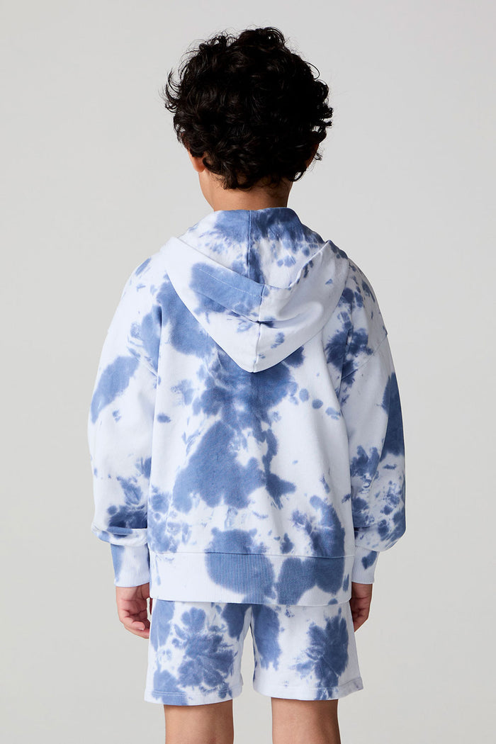 Back view of a boy wearing the Chaser Paxton Mistel Tie Dye Zip Up Hoodie on a neutral background