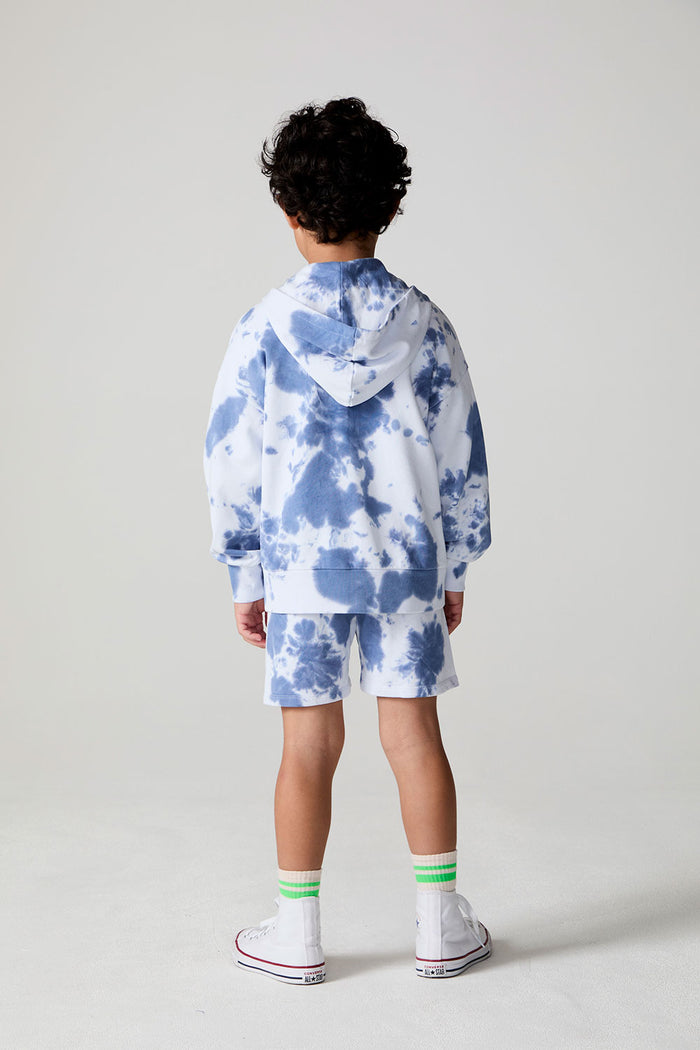 Full body back view of a boy wearing the Chaser Paxton Mistel Tie Dye Zip Up Hoodie on a neutral background