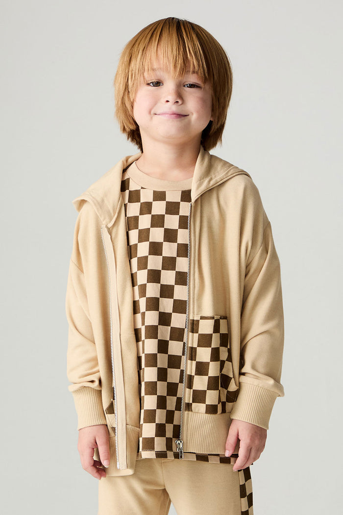 Front view of a boy wearing the Chaser Paxton Zip Up Hoodie Boys Zip Hoodie on a neutral background with hands at sides and matching pants