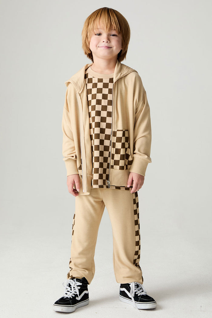 A full body front view of a boy wearing the Chaser Paxton Zip Up Hoodie Boys Zip Hoodie on a neutral background
