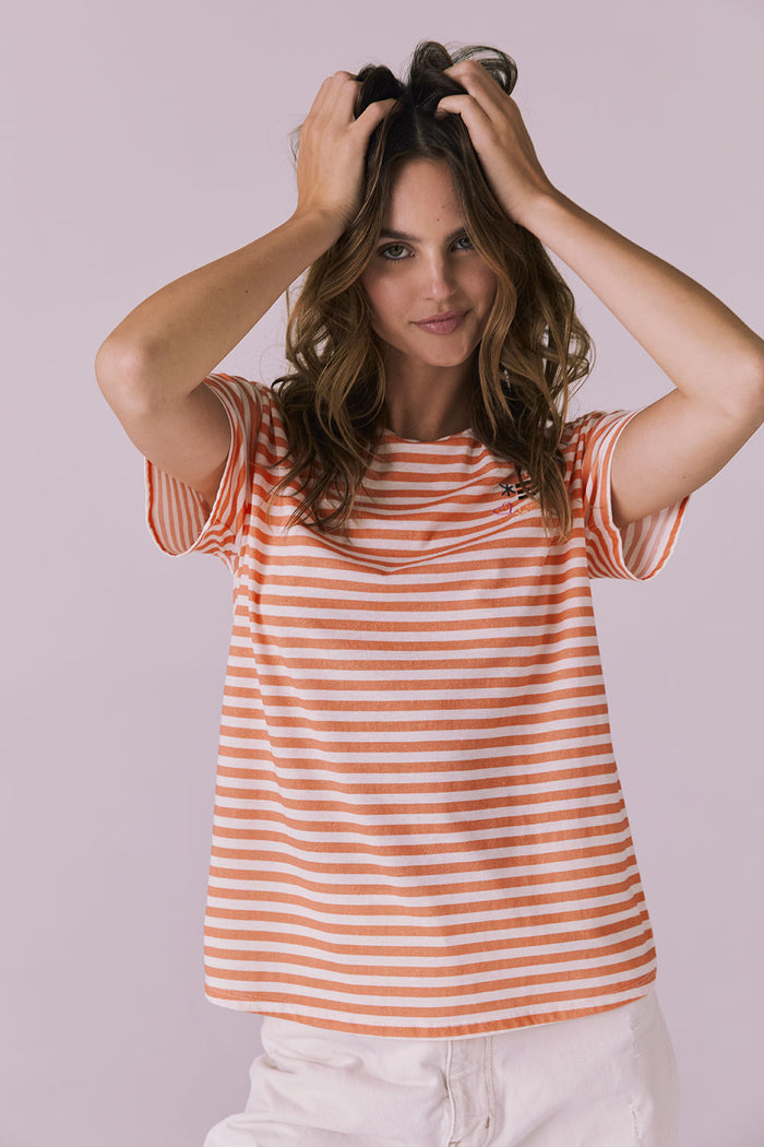 Front shot of the Peace + Love Embroidery Tee in Poppy Stripe with an easy drape and short sleeve silhouette