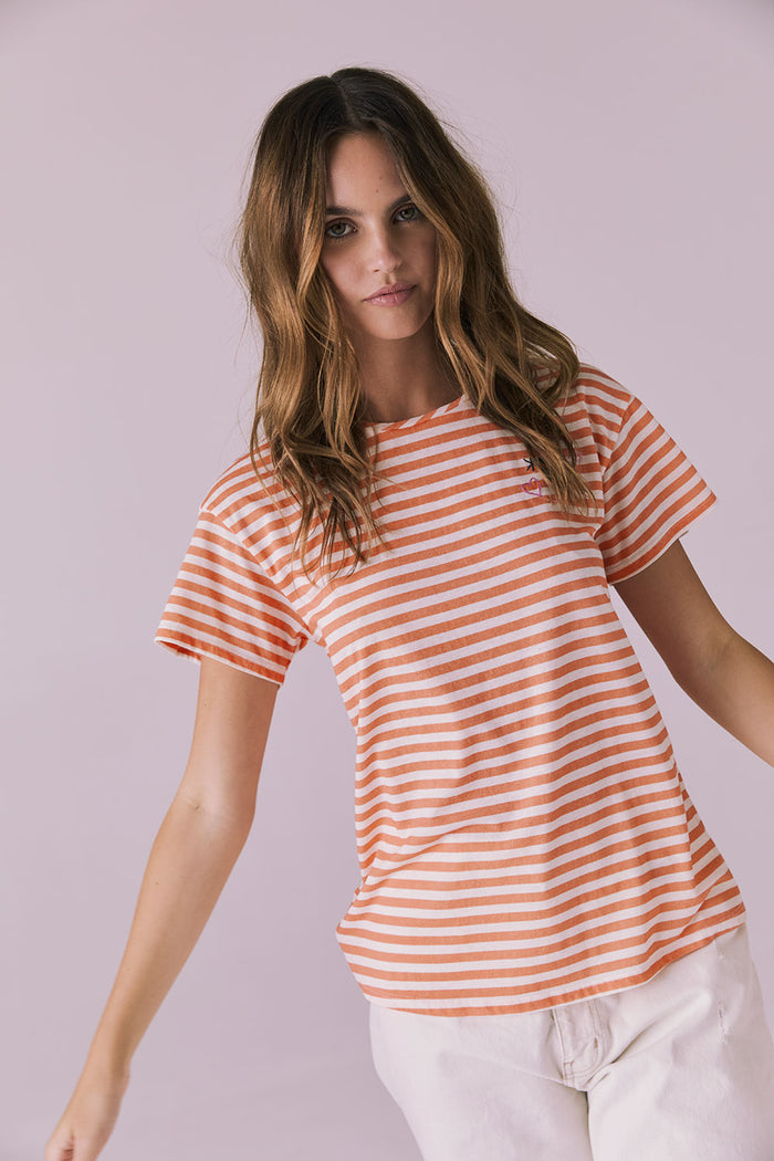 Slight movement angle of the Peace + Love Embroidery Tee in Poppy Stripe showing the soft fabric and casual shape