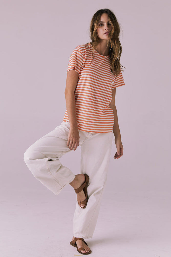 Full body view of the Peace + Love Embroidery Tee in Poppy Stripe styled with light denim and sandals