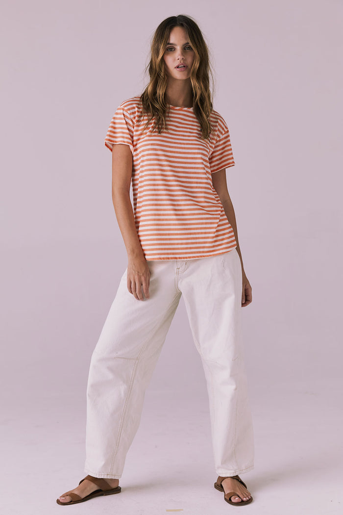 Full body standing shot of the Chaser Peace + Love Embroidery Tee in Poppy Stripe with a clean, relaxed look