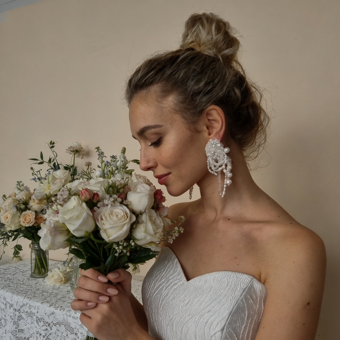 Luxury statement bridal earrings with bead embroidery, freshwater pearls, crystal tassels and romantic couture wedding styling.