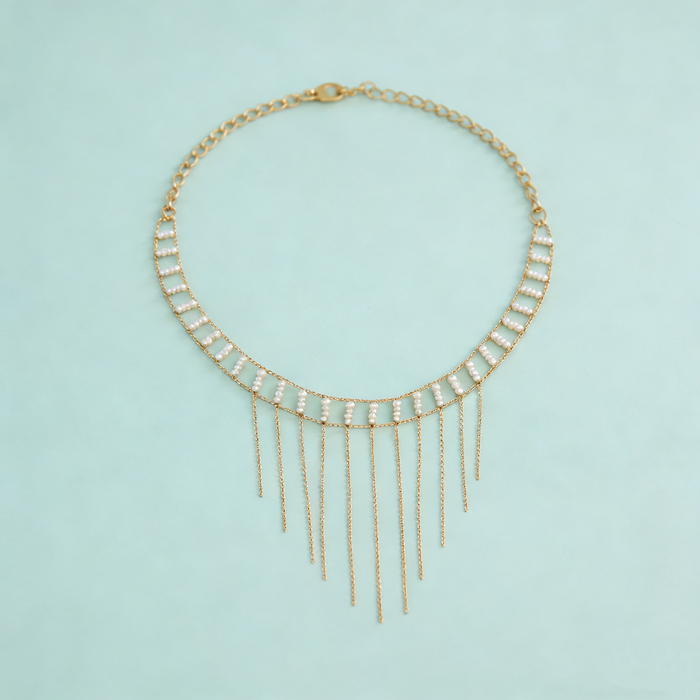 Freshwater pearl fringe choker necklace handcrafted with 14K gold plated copper chain and cascading pearl details.