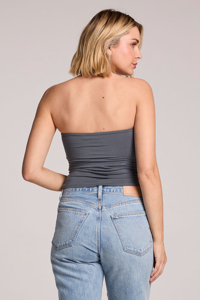 A back view of a woman wearing the Chaser Future Grey Pearl Tube Top on a neutral background