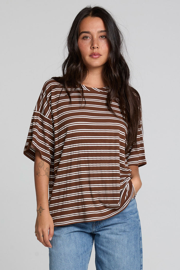Front view of a woman wearing the Chaser Peri Nutty Brown Stripe Tee on a neutral background