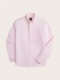Pink oxford shirt laid flat, front view, on cream background