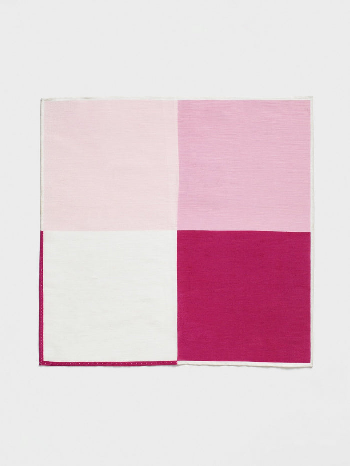 Pink and white quad-panel pocket square laid flat on white background