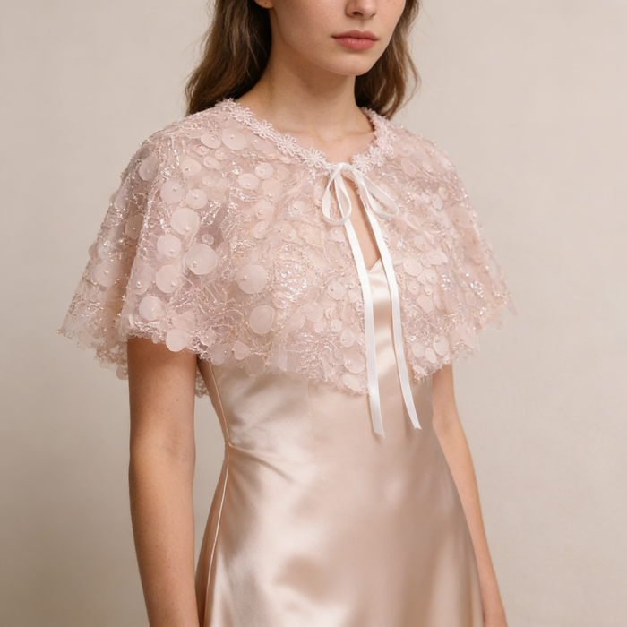 Hand embellished pink wedding cape with sparkling sequin details, lightweight bridal shoulder cover.