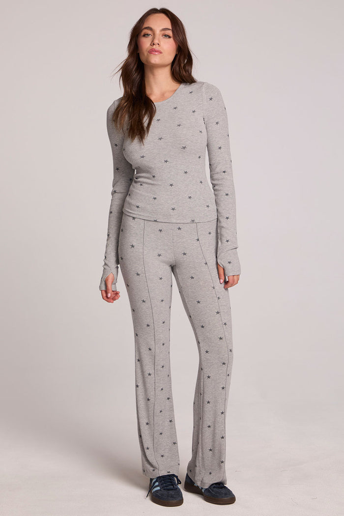 Front full body view of a woman wearing the Chaser Porta Light Heather Grey Long Sleeve on a neutral background with matching grey pants and hands at sides