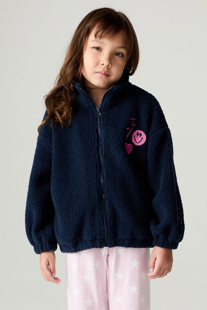 Front view of a girl wearing the Chaser Power Love Girls Jacket on a neutral background with arms down and pink pants