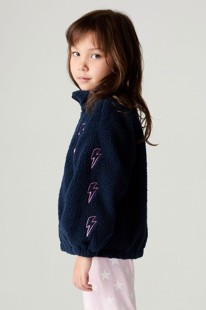 Side view of a girl wearing the Chaser Power Love Girls Jacket on a neutral background with arms at sides