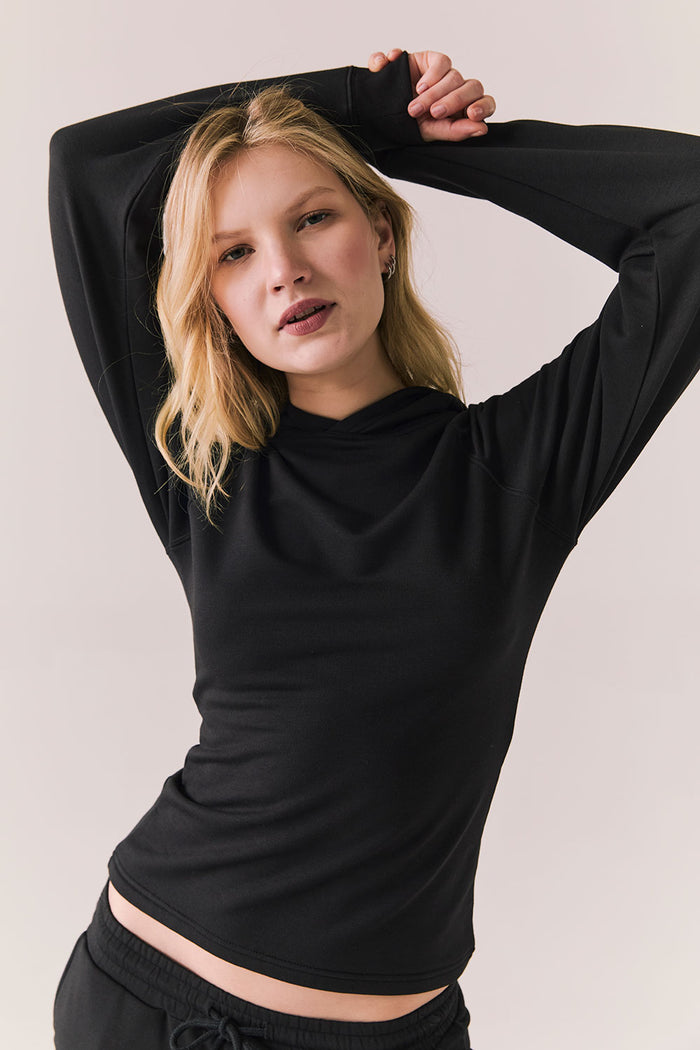 True black pullover hoodie with minimalist design and soft finish.