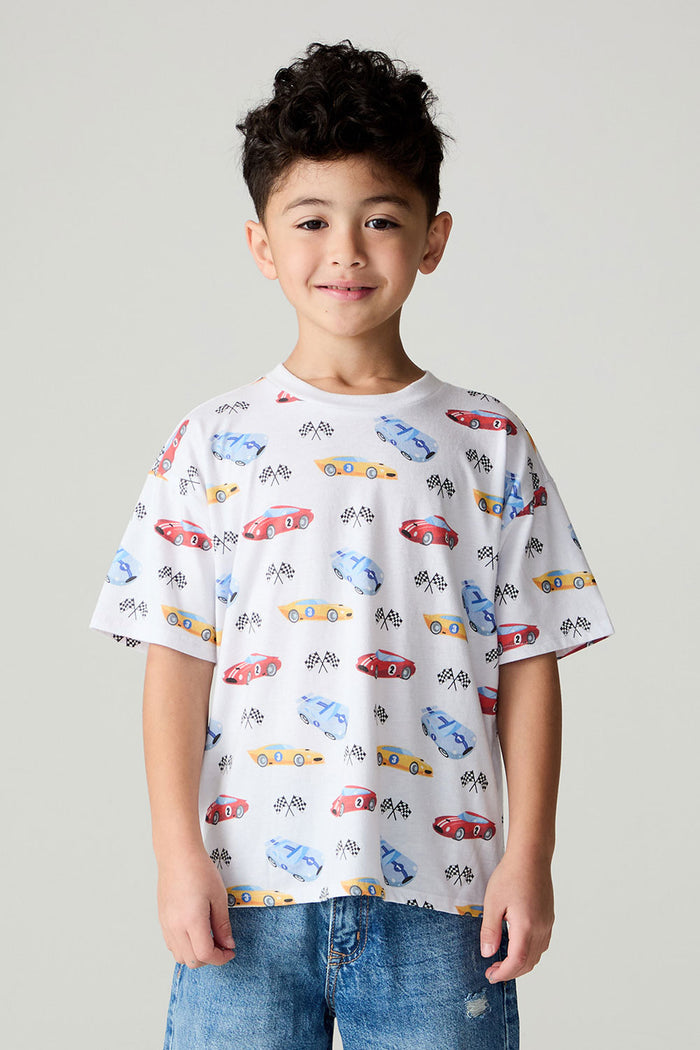 Front view of a boy wearing the Chaser Race Day Boys Tee on a neutral background with bluejeans