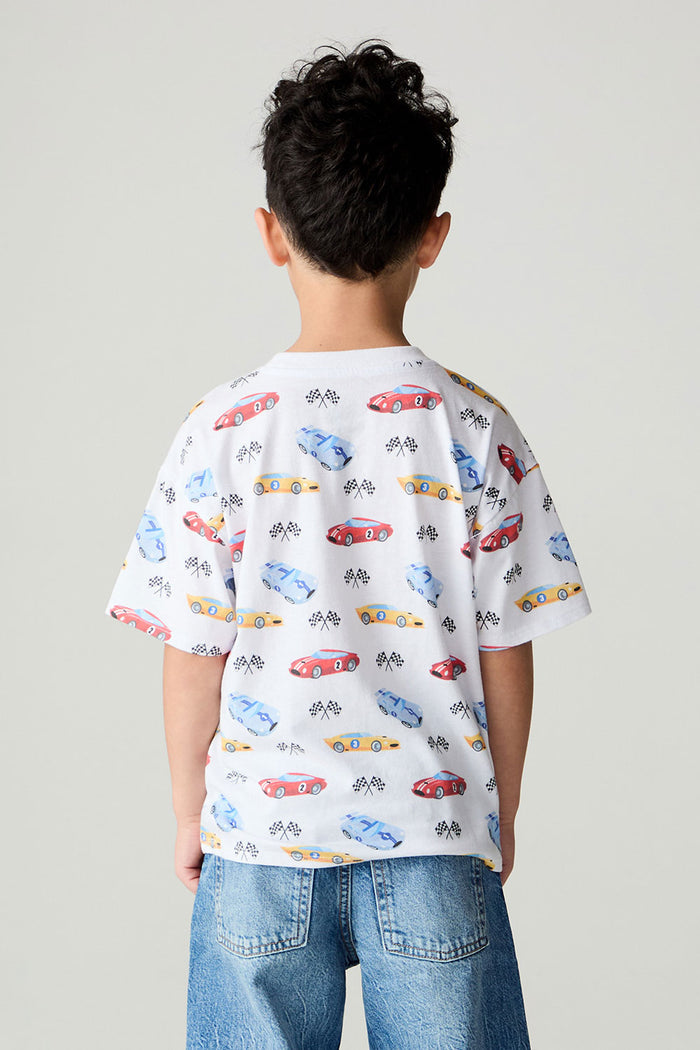 Back view of a boy wearing the Chaser Race Day Boys Tee on a neutral background with jeans