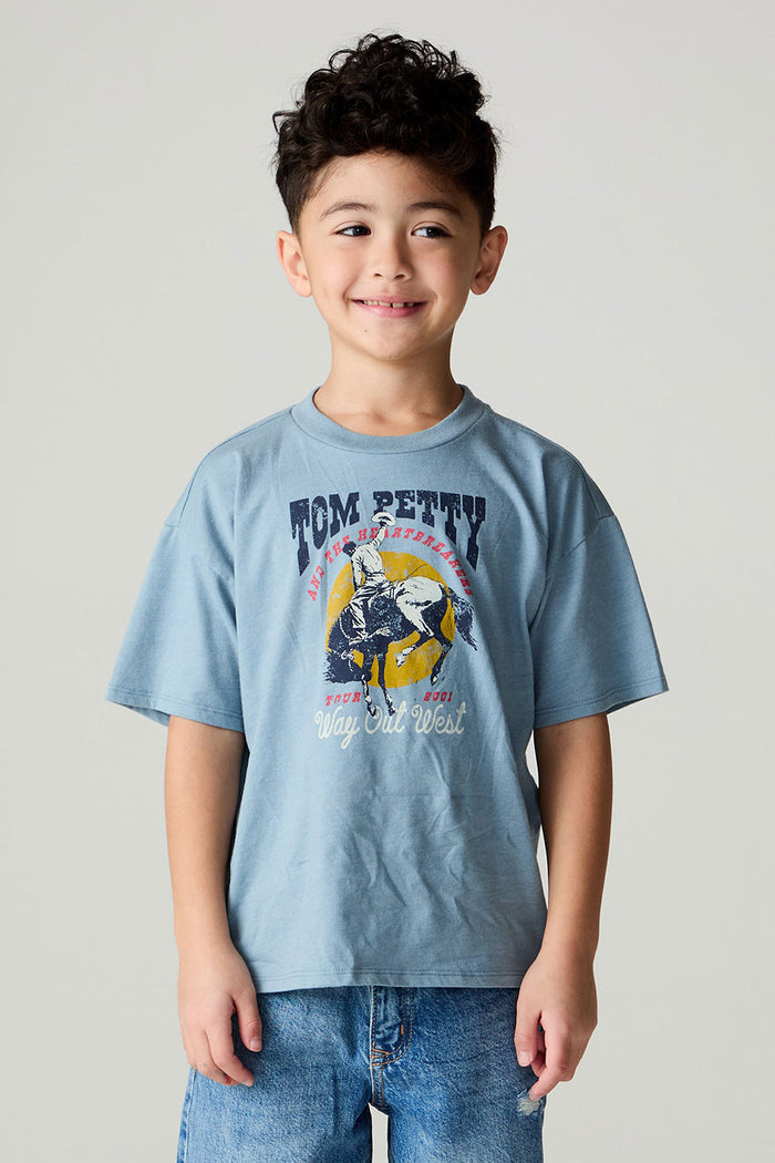 Front view of a boy wearing the Chaser Racers Boys Tee on a neutral background with jeans and arms at sides and jeans