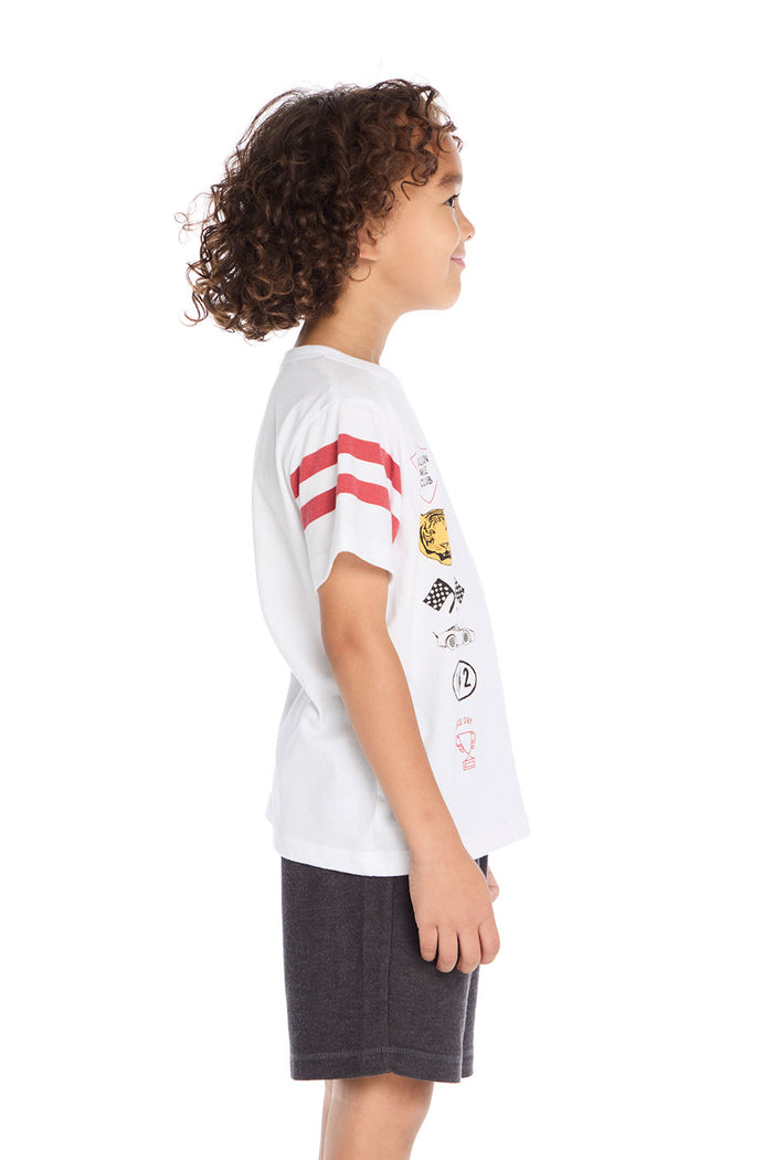 Side view of the Chaser Kids Racing Symbols Tee in white showing the red racing stripes along the sleeves and graphic details