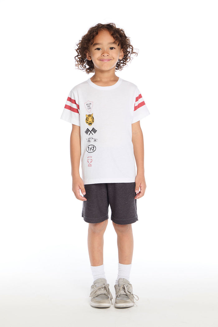 Full body view of the Chaser Kids Racing Symbols Tee in white shown with the Vintage Black Cozy Knit Cozy Beach Short on a white background
