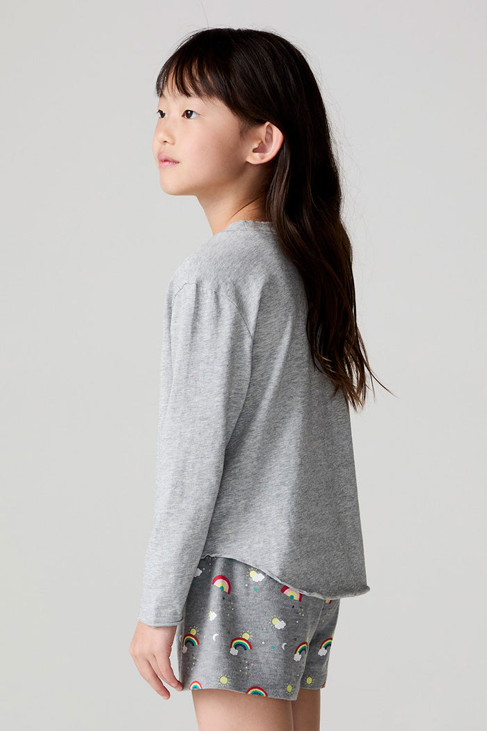 Side view of a girl wearing the Chaser Rainbow Morning Long Sleeve on a neutral background
