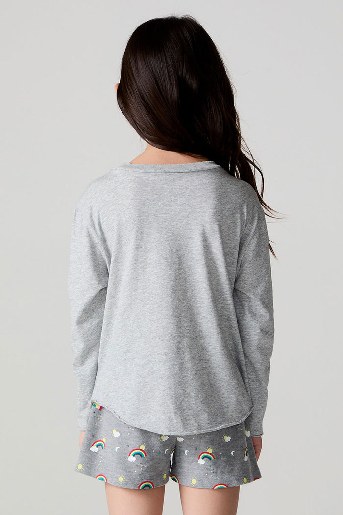 Back view of a girl wearing the Chaser Rainbow Morning Long Sleeve on a neutral background