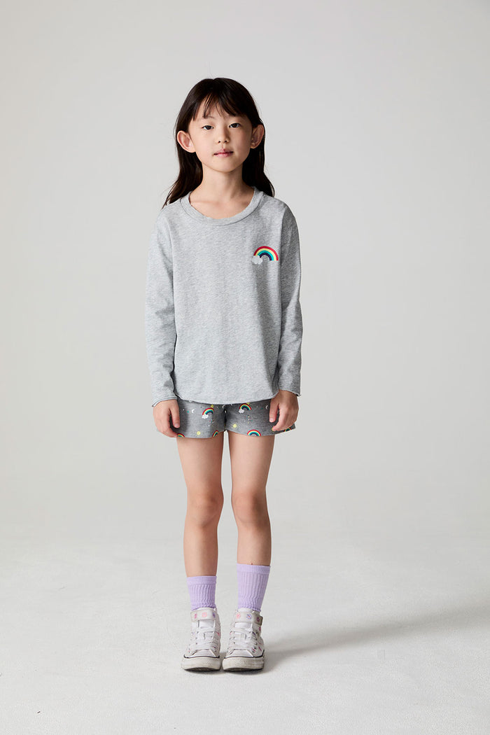 Full body front view of a girl wearing the Chaser Rainbow Morning Long Sleeve on a neutral background
