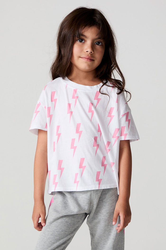 Front view of a girl wearing the Chaser Raining Bolts Tee on a neutral background