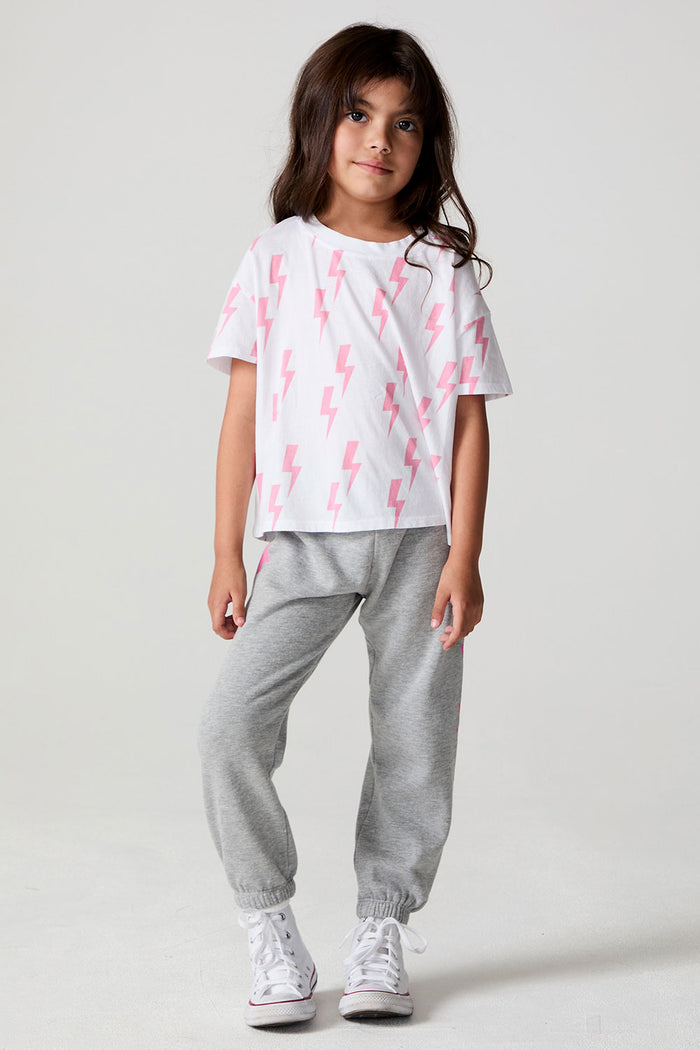 Full body front view of a girl wearing the Chaser Raining Bolts Tee on a neutral background