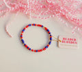 Red and blue beaded blonde