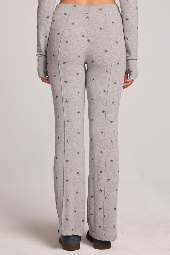 Back view of a woman wearing the Chaser Rhose Light Heather Grey Pants on a neutral background with arms at sides