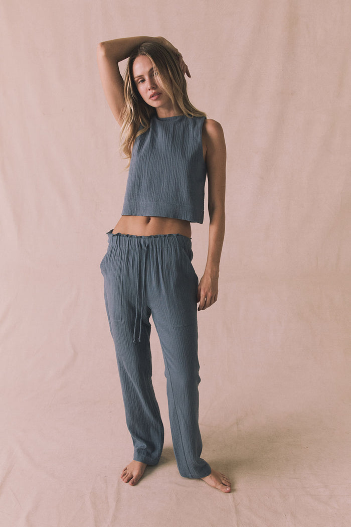 Full body editorial view of the Riley Tank in Future Grey styled with the matching Bellow Joggers
