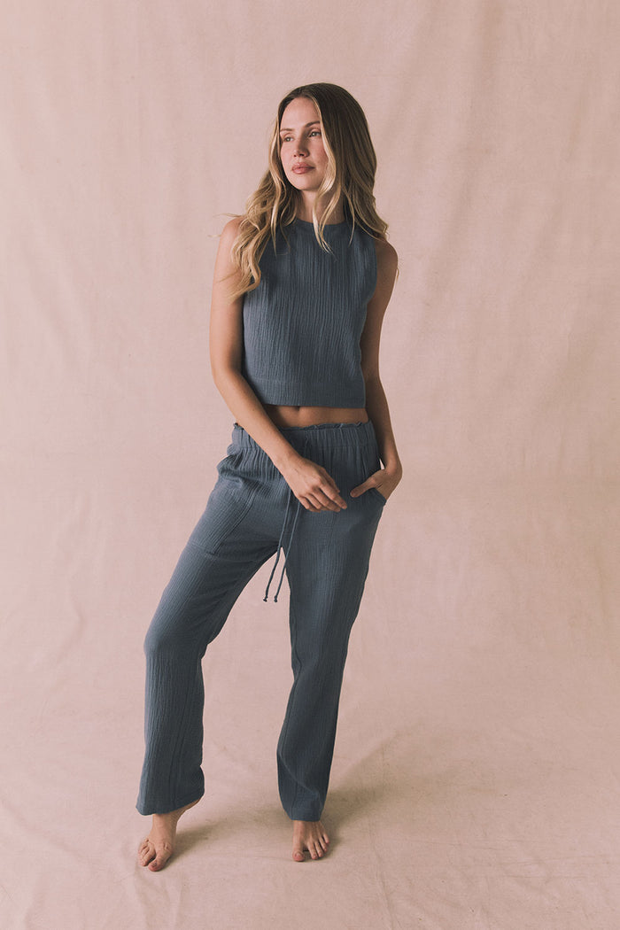 Full body editorial shot of the Riley Tank in Future Grey paired with the matching Bellow Joggers