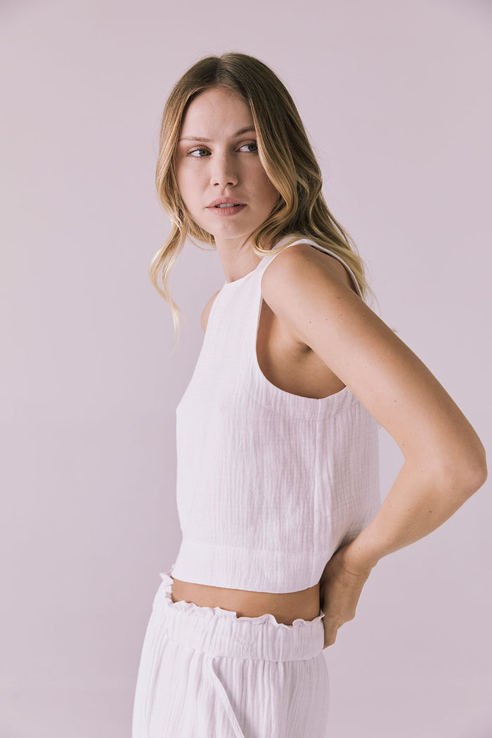 Riley White Tank side studio angle showing the relaxed arm opening and soft gauze texture