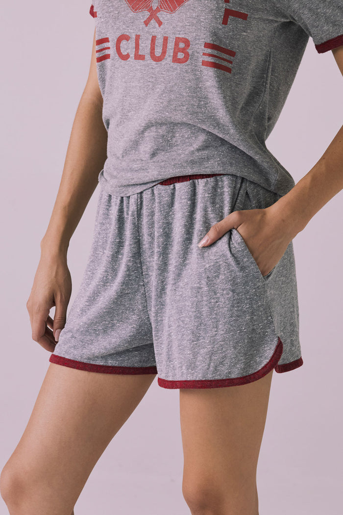 Side close-up view of the Ringer Shorts in Heather Grey with Crimson trim showing the relaxed fit and pocket opening