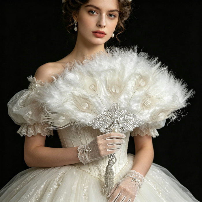 Luxury feather hand fan with pearl embroidery and crystal embellishments styled for a romantic bridal gown and elegant ballroom look.