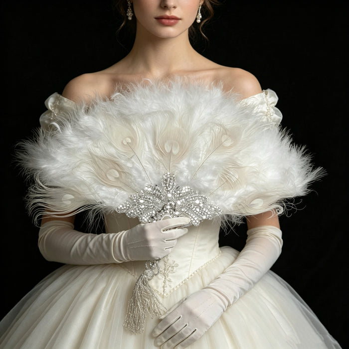 Luxury feather hand fan with pearl embroidery and crystal embellishments styled for a romantic bridal gown and elegant ballroom look.