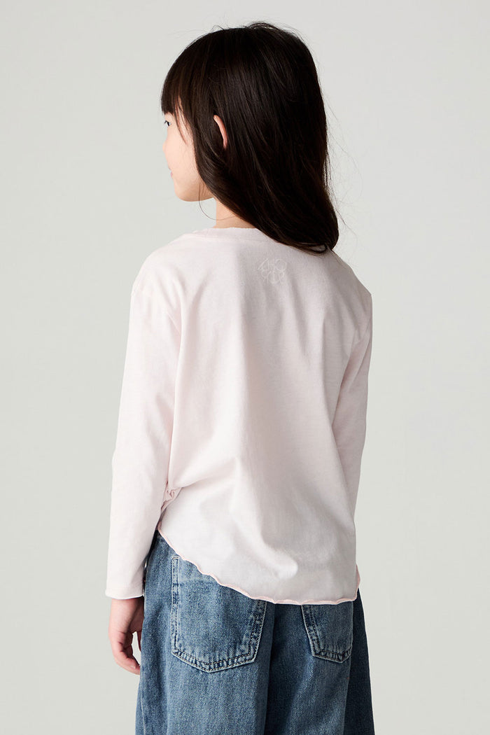 Back view of a girl wearing the Chaser Rolling Stones Luv The Stones Girls Tee on a neutral background with jeans