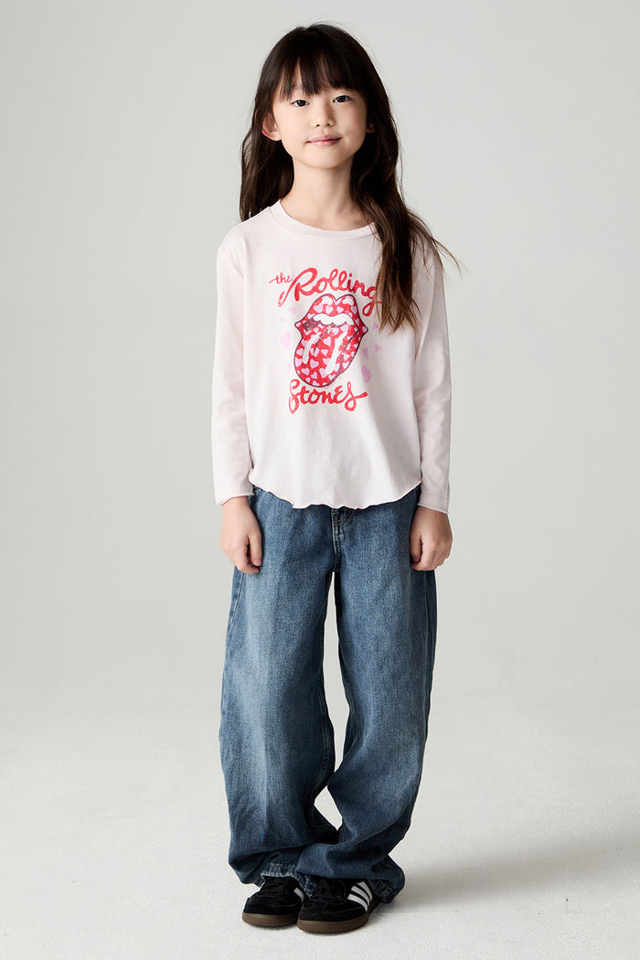 A full body front view of a girl wearing the Chaser Rolling Stones Luv The Stones Girls Tee on a neutral background