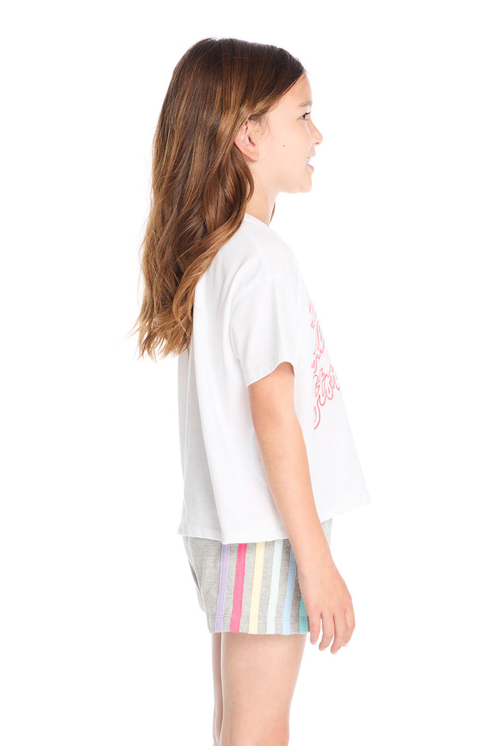 Side view of the Chaser Kids Rolling Stones Painterly Tongue Logo Tee showing the relaxed fit and lightweight fabric in classic white