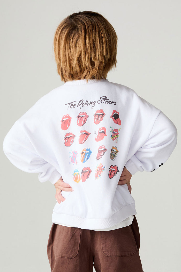 Back view of a boy wearing the Chaser Rolling Stones Pop Tongues Boys Tee on a neutral background with arms on hips