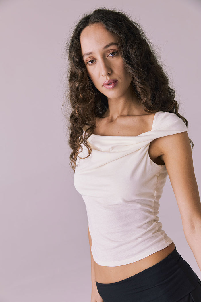 Chaser Roxanne Starry White Tank shown in a three quarter front view with gentle folds along the neckline