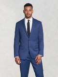 Man in royal blue suit with white shirt and black tie, front view on light grey background