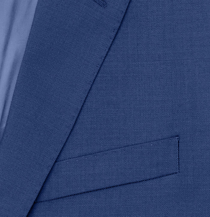 Close-up of royal blue suit jacket lapel and pocket flap fabric texture