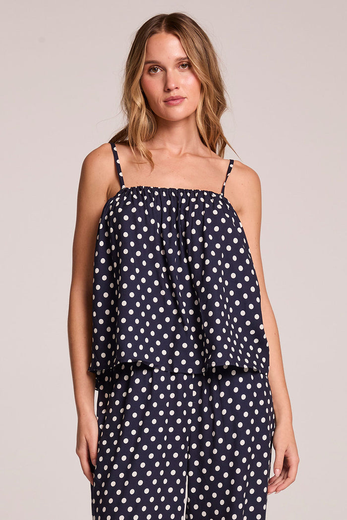 Front view of a woman wearing the Chaser   Rubie Navy Spot Tank Top and matching pants on a neutral background