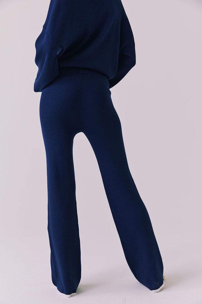 Back angled view of the Sailor Worn Blue Joggers showing the ribbed fabric and clean back fit